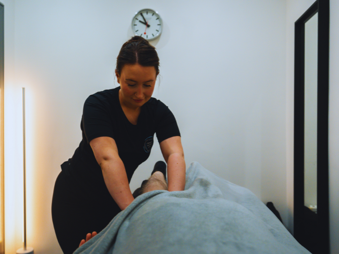 Glasgow Massage Clinic therapist providing a massage treatment to a client in a calm treatment room.